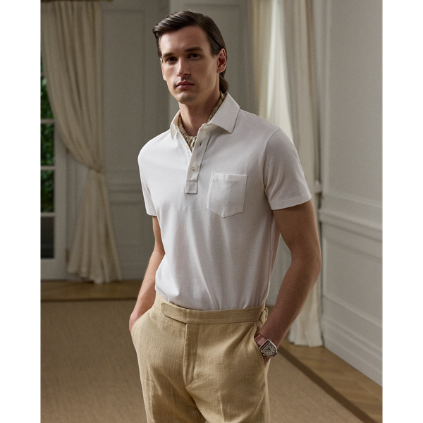 This Purple Label Polo shirt is crafted with custom-developed cotton piqué and washed to achieve an incredibly soft texture. At the left sleeve, it is intricately embroidered with " Ralph Lauren Lauren" in script letters.