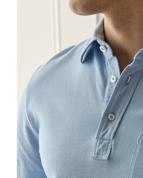 This Purple Label Polo shirt is crafted with custom-developed cotton piqué and washed to achieve an incredibly soft texture. At the left sleeve, it is intricately embroidered with " Ralph Lauren Lauren" in script letters.