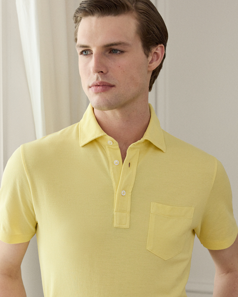 This Purple Label Polo shirt is crafted with custom-developed cotton piqué and washed to achieve an incredibly soft texture. At the left sleeve, it is intricately embroidered with " Ralph Lauren Lauren" in script letters.