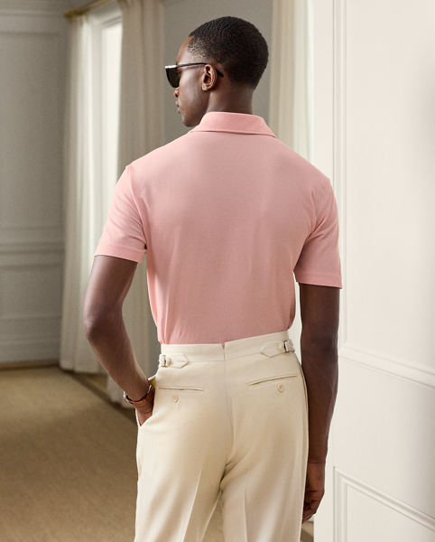 This Purple Label Polo shirt is crafted with custom-developed cotton piqué and washed to achieve an incredibly soft texture. At the left sleeve, it is intricately embroidered with " Ralph Lauren Lauren" in script letters.