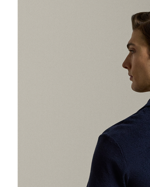 Expertly crafted in Portugal, this Polo shirt exemplifies casual elegance with its lightweight cotton-blend terry fabric, which is both comfortable and luxurious. It is meticulously embroidered with our signature " Ralph Lauren Lauren" script logo on the right sleeve.