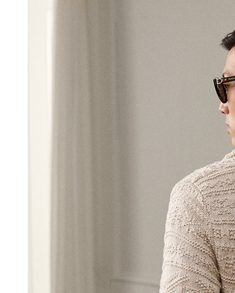 Masterfully crafted in Italy, this shawl-collar cardigan exemplifies  Ralph Lauren Lauren Purple Label's commitment to unparalleled luxury, showcasing an intricate textured-knit technique rendered in a refined cotton-and-wool blend.