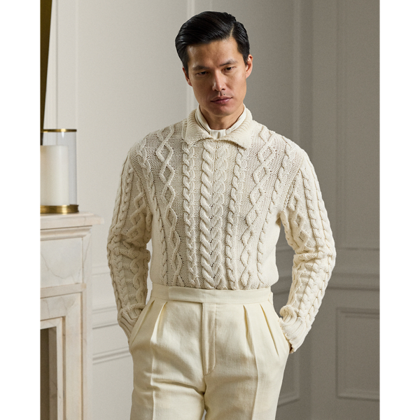 Meticulously crafted in Italy, this jumper showcases an intricate composition of cable-knit patterns, expertly rendered in substantial cotton-blend yarns to create tactile richness. The addition of a refined Polo collar reflects Purple Label's philosophy of understated sartorial elegance.