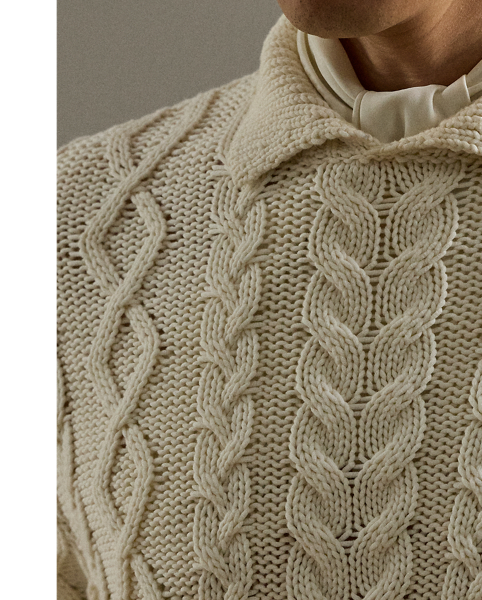 Meticulously crafted in Italy, this jumper showcases an intricate composition of cable-knit patterns, expertly rendered in substantial cotton-blend yarns to create tactile richness. The addition of a refined Polo collar reflects Purple Label's philosophy of understated sartorial elegance.