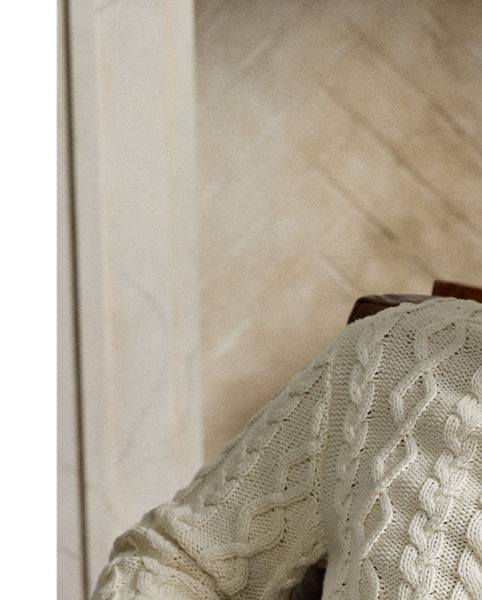 Meticulously crafted in Italy, this jumper showcases an intricate composition of cable-knit patterns, expertly rendered in substantial cotton-blend yarns to create tactile richness. The addition of a refined Polo collar reflects Purple Label's philosophy of understated sartorial elegance.