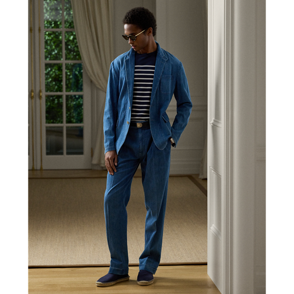 Inspired by elegant British apparel from the 1920s, these trousers feature an oversize fit with a wider leg opening. They are hand-tailored in Italy from Japanese denim that is woven with cotton and linen. Rendered in a medium-indigo hue, this pair is specially treated to achieve whiskering and is detailed with hand-sanding.