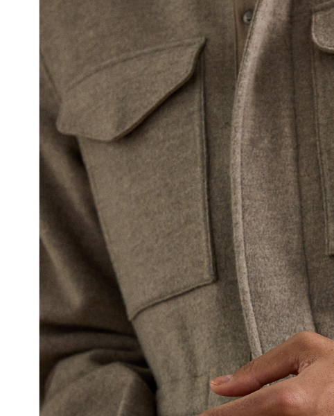 This surplus-inspired jacket is expertly crafted in Italy from a substantial double-faced fabric that is woven with fine wool and cashmere. Lined at the sleeves with luxurious silk, the distinguished design is meticulously finished with supple suede trim.