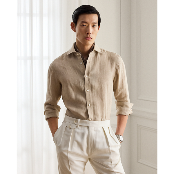 Masterfully crafted in Italy, this shirt imparts an elegant ease with its luxuriously lightweight linen and tick-weave construction. The distinguished design features a bespoke hue and is beautifully finished with genuine mother-of-pearl buttons, showcasing Purple Label's dedication to sartorial excellence.