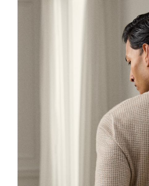 Uniting multiple fine-gauge cashmere yarns and a jacquard-knit technique, this Italian-crafted jumper is an exemplary take on tone and texture. The lightweight layer reimagines  Ralph Lauren Lauren's iconic Polo shirt silhouette and features considered details such as genuine mother-of-pearl buttons. Its classic houndstooth pattern draws inspiration from a woven fabric that is used in the Purple Label collection.