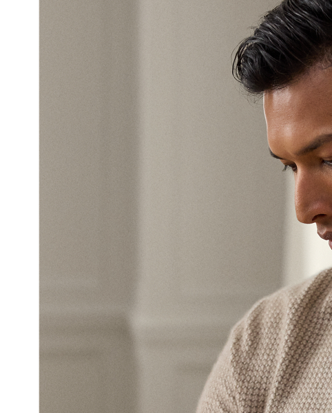 Uniting multiple fine-gauge cashmere yarns and a jacquard-knit technique, this Italian-crafted jumper is an exemplary take on tone and texture. The lightweight layer reimagines  Ralph Lauren Lauren's iconic Polo shirt silhouette and features considered details such as genuine mother-of-pearl buttons. Its classic houndstooth pattern draws inspiration from a woven fabric that is used in the Purple Label collection.