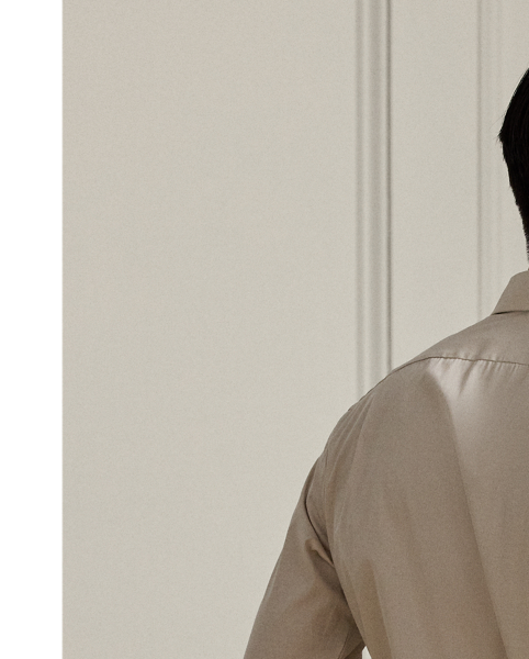 Expertly crafted in Italy from fine cotton in an end-on-end weave, this shirt showcases  Ralph Lauren Lauren's commitment to unparalleled quality and timeless style. Genuine mother-of-pearl buttons give it a sophisticated look, which is quintessentially Purple Label.