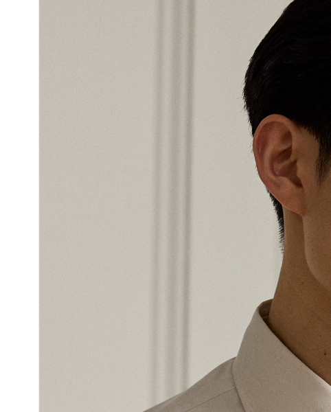 Expertly crafted in Italy from fine cotton in an end-on-end weave, this shirt showcases  Ralph Lauren Lauren's commitment to unparalleled quality and timeless style. Genuine mother-of-pearl buttons give it a sophisticated look, which is quintessentially Purple Label.