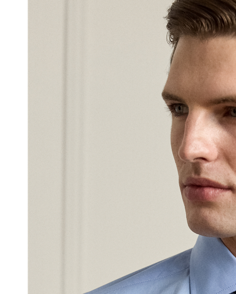 Crafted in Italy with fine cotton in an end-on-end weave, this shirt showcases  Ralph Lauren Lauren's commitment to unparalleled quality and timeless style. The custom-developed hue genuine mother-of-pearl buttons give it a sophisticated look that is purely Purple Label.