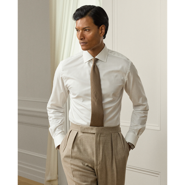 Crafted with premium cotton twill and enhanced with a crease-resistant treatment, this shirt represents the perfect fusion of modern innovation and timeless luxury. Each detail is thoughtfully considered, from the fabric's exceptional durability to the genuine mother-of-pearl buttons.