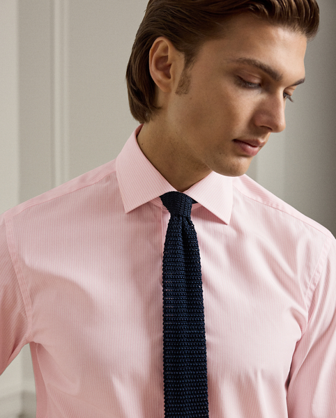 Meticulously crafted in Italy, this striped shirt exemplifies sartorial excellence through its silky, super-fine cotton twill and genuine mother-of-pearl buttons. The precise compact weave of the cloth delivers superior colour brilliance, beautifully showcasing the bespoke hue, which was custom-developed with a storied Italian mill.