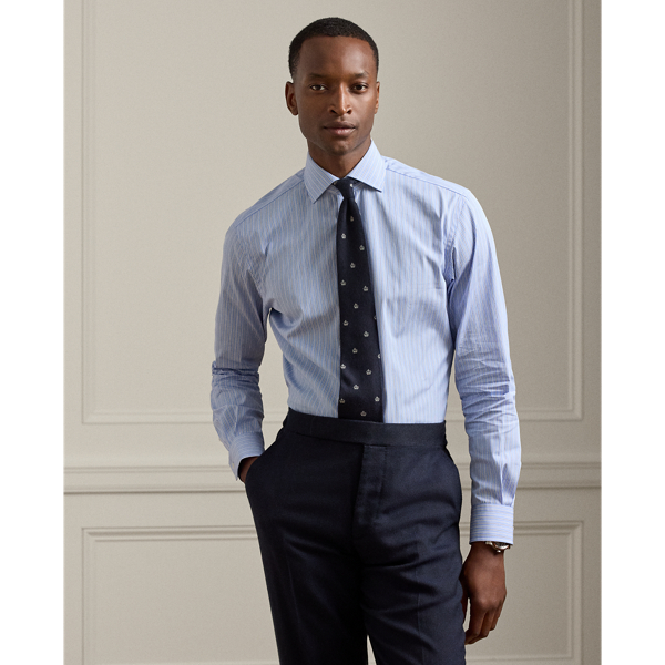 Expertly tailored in Italy, this Purple Label shirt exemplifies sartorial excellence through its luxuriously lightweight cotton fabric. It is thoughtfully finished with genuine mother-of-pearl buttons, resulting in a sophisticated garment that showcases superior crafting and timeless elegance.