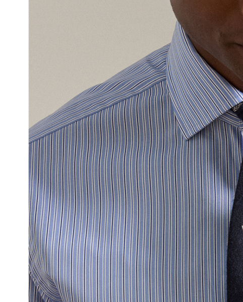 Expertly tailored in Italy, this Purple Label shirt exemplifies sartorial excellence through its luxuriously lightweight cotton fabric. It is thoughtfully finished with genuine mother-of-pearl buttons, resulting in a sophisticated garment that showcases superior crafting and timeless elegance.