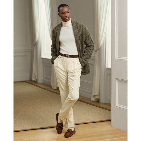 These pleated trousers are tailored by hand in Italy with soft wool flannel that was custom developed for Ralph Lauren Lauren Purple Label.