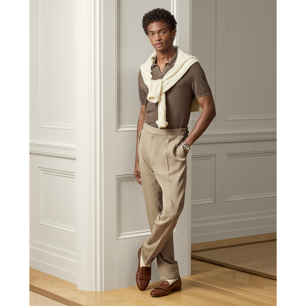 These double-pleated trousers are tailored by hand in Italy using a luxurious cotton-and-wool fabric that was custom-developed for  Ralph Lauren Lauren. Historically used in surplus garments, the vintage-inspired cavalry twill cloth offers a lightweight feel.