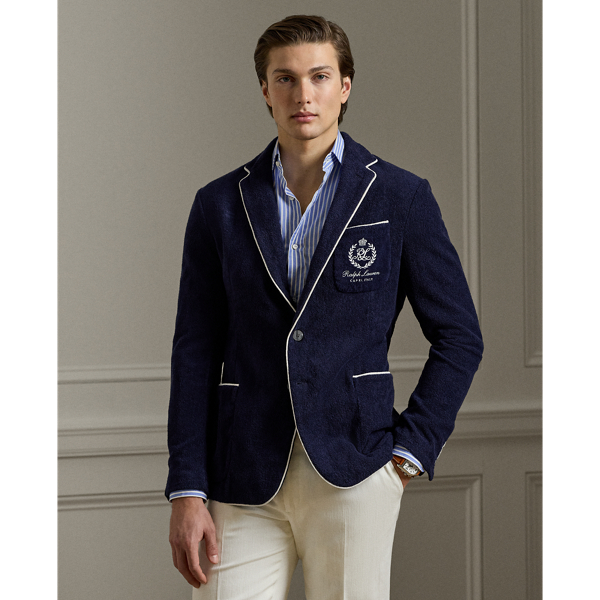 This blazer's plush cotton terry is transformed through masterful Italian hand-tailoring to create a statement of sophisticated ease. Our signature metal buttons and embroidered " Ralph Lauren Lauren" crest perfectly balances heritage detailing with contemporary comfort.