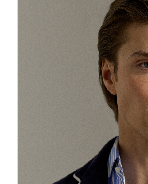 This blazer's plush cotton terry is transformed through masterful Italian hand-tailoring to create a statement of sophisticated ease. Our signature metal buttons and embroidered " Ralph Lauren Lauren" crest perfectly balances heritage detailing with contemporary comfort.