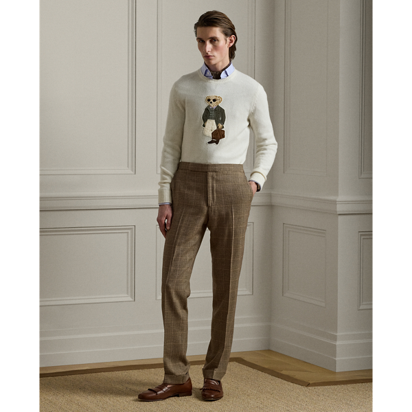 These trousers are handcrafted in Italy from a lightweight fabric custom-developed with Ireland's Magee 1866 mill, which has been a  Ralph Lauren Lauren partner for more than 50 years. Its Glen plaid pattern is woven as herringbone with a distinctive overcheck using a luxurious blend of wool, mulberry silk and cashmere.