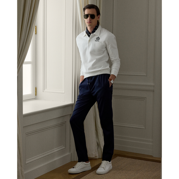 These trousers' Italian satin fabric was custom-developed using a cotton blend that includes silk and a hint of stretch. Constructed with an elastic drawstring waistband, they combine the look of traditional tailoring with the modern comfort of Purple Label sportswear.