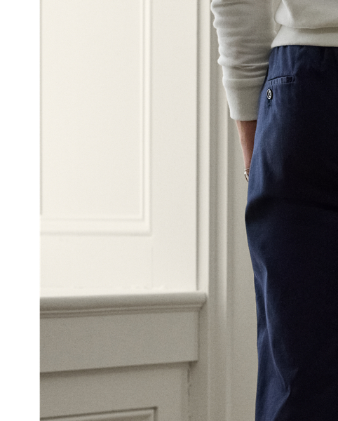 These trousers' Italian satin fabric was custom-developed using a cotton blend that includes silk and a hint of stretch. Constructed with an elastic drawstring waistband, they combine the look of traditional tailoring with the modern comfort of Purple Label sportswear.