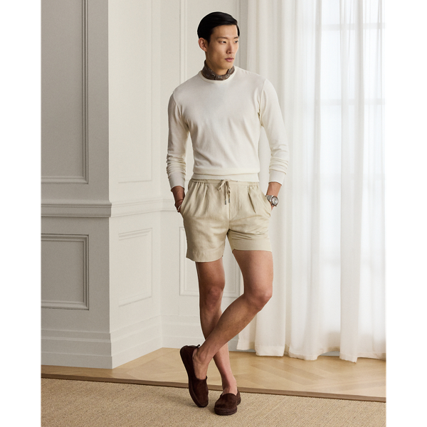 These pleated shorts are expertly hand-tailored from a lightweight Italian cloth that was custom-developed for  Ralph Lauren Lauren. Woven with textured silk and fine linen, the fabric is washed prior to construction and offers a soft, vintage-inspired effect.