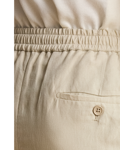 These pleated shorts are expertly hand-tailored from a lightweight Italian cloth that was custom-developed for  Ralph Lauren Lauren. Woven with textured silk and fine linen, the fabric is washed prior to construction and offers a soft, vintage-inspired effect.