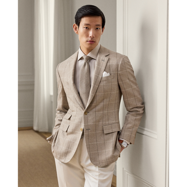 Meticulously hand-tailored in Italy, the Kent combines a lighter construction with fine canvassing and a soft shoulder to create a more natural profile. This version's fabric was custom-developed for  Ralph Lauren Lauren with Joshua Ellis, a famed English mill that has been creating luxury textiles for more than 250 years. The brushed twill cloth features a traditional plaid pattern reimagined in a seasonless blend of wool, silk and cashmere.