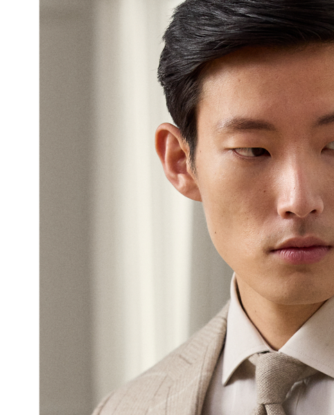 Meticulously hand-tailored in Italy, the Kent combines a lighter construction with fine canvassing and a soft shoulder to create a more natural profile. This version's fabric was custom-developed for  Ralph Lauren Lauren with Joshua Ellis, a famed English mill that has been creating luxury textiles for more than 250 years. The brushed twill cloth features a traditional plaid pattern reimagined in a seasonless blend of wool, silk and cashmere.