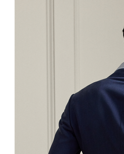 Hand-tailored in Italy, the Kent combines a lighter construction with fine canvassing and a soft shoulder to create a more natural profile. This trench version is woven with luxurious silk and custom-developed for  Ralph Lauren Lauren Purple Label.