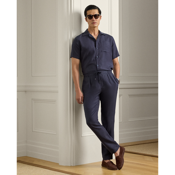 These pleated trousers are hand-tailored using a lightweight cloth that was custom-developed for  Ralph Lauren Lauren. Woven with textured silk and fine linen, the Italian fabric is washed prior to construction and offers a soft, vintage-inspired effect.