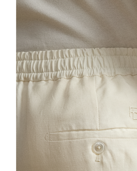 These pleated shorts are hand-tailored using a lightweight cloth, which was custom-developed for  Ralph Lauren Lauren. Woven from textured silk and fine linen, the Italian fabric is washed prior to construction and offers a soft, vintage-inspired effect.