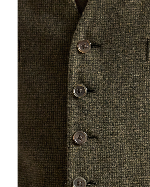 This waistcoat is hand-tailored in Italy from a textured tick-weave cloth, which draws inspiration from a classic  Ralph Lauren Lauren pattern. The custom-developed fabric is beautifully woven with a blend of wool, silk and cashmere.