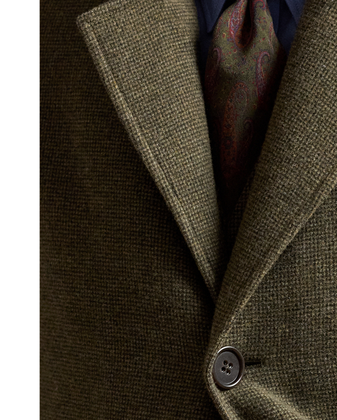 Hand-tailored in Italy, this topcoat is crafted from a textured tick-weave cloth, which draws inspiration from a classic  Ralph Lauren Lauren pattern. The custom-developed fabric is beautifully woven from a blend of wool, silk and cashmere.